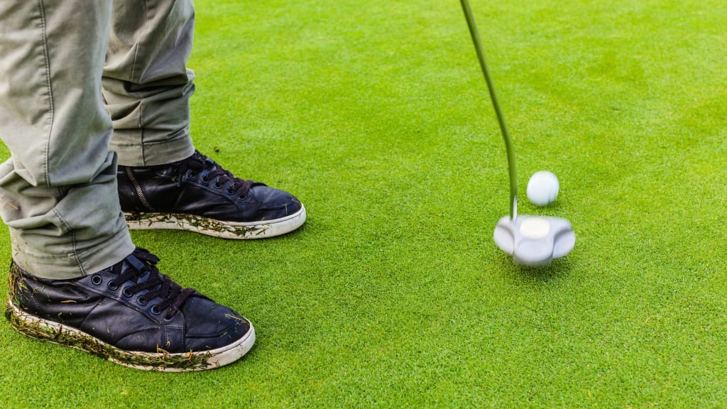 Men making a Putt to Hit a Golf Ball